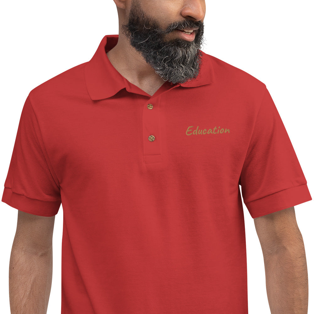 Education In Copper Embroidery on Men's Polo Shirt