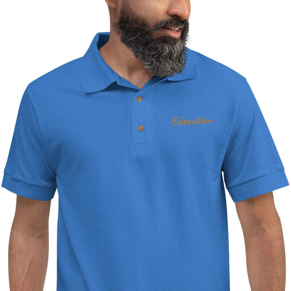 Education In Copper Embroidery on Men's Polo Shirt