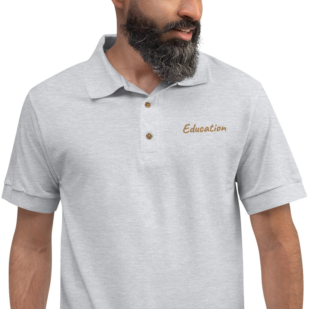 Education In Copper Embroidery on Men's Polo Shirt