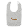 Team In Celluloid Embroidery on Baby Bib